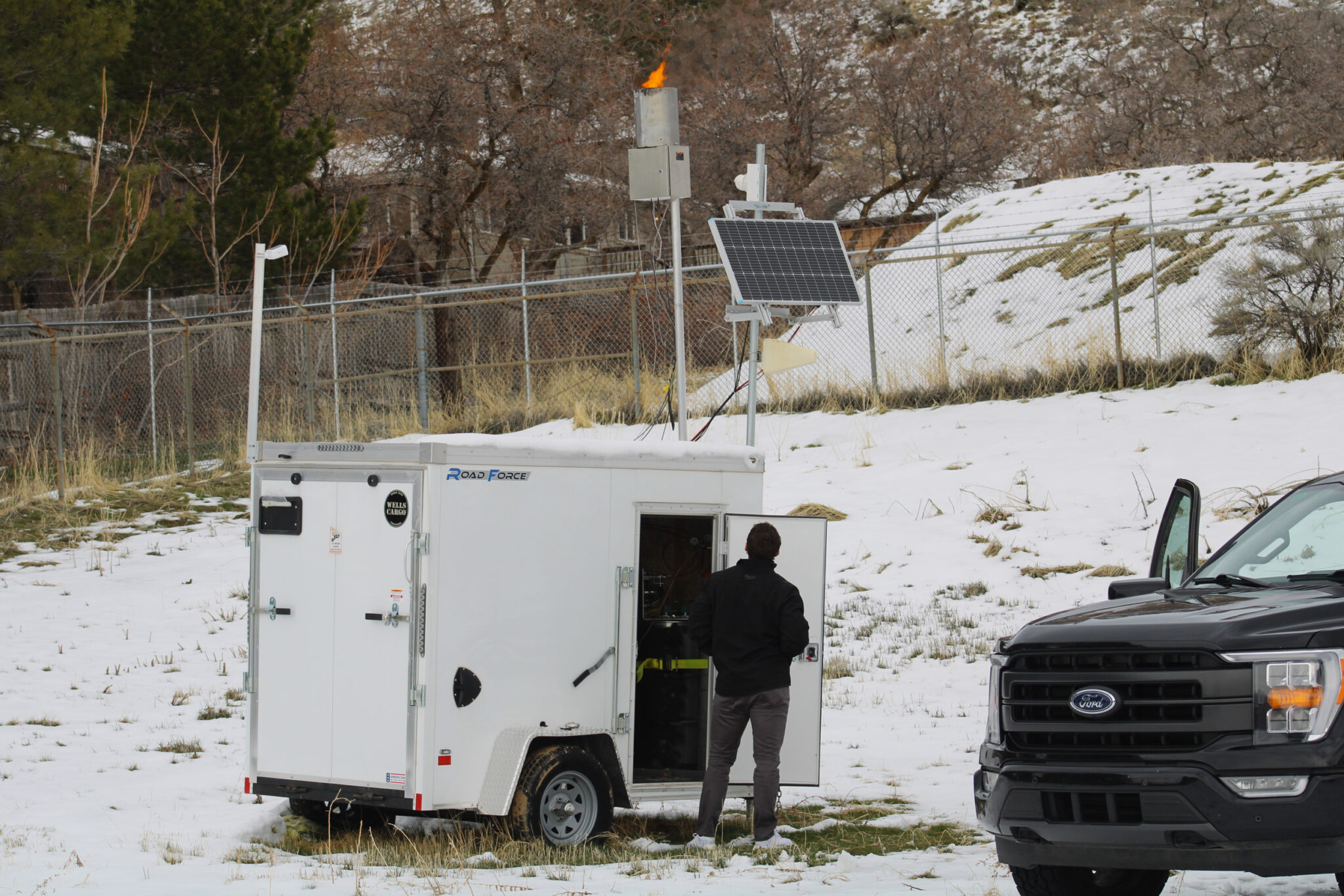 News photo: A technician with North American Weather Consultants works on a cloud seeding generator in Ogden, Utah on March 20. Utah has the nation's largest program, and nearby states are watching to see how it adds to the water supply. Credit: Alex Hager/KUNC